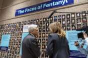Attorney General Merrick Garland accompanied by U.S. Drug Enforcement Administration Administrator Anne Milgram,​ looks at photographs of people who had died from drugs during the Second Annual Family Summit on Fentanyl at DEA Headquarters in Washington, Tuesday, Sept. 26, 2023. (AP Photo/Jose Luis Magana) Associated Press/LaPresse Only Italy and Spain