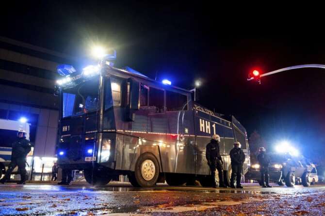 A police water cannon is ready on Halloween night during celebrations in the district of Harburg, in Hamburg, Germany. Tuesday, Oct. 31, 2023. (Daniel Bockwoldt/dpa via AP) Associated Press/LaPresse Only Italy and Spain