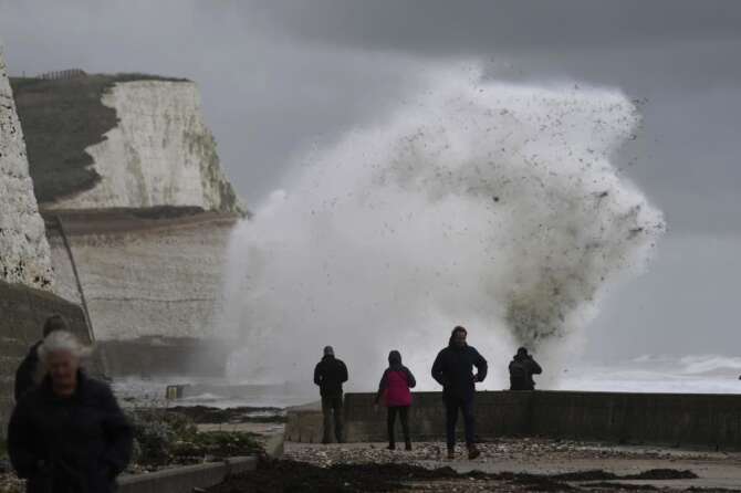 Waves crash over the harbour wall in Newhaven, southern England, Thursday, Nov. 2, 2023. Winds up to 180 kilometers per hour (108 mph) slammed France’s Atlantic coast overnight as Storm Ciaran lashed countries around western Europe, uprooting trees, blowing out windows and leaving 1.2 million French households without electricity Thursday. Strong winds and rain also battered southern England and the Channel Islands, where gusts of more than 160 kph (100 mph) were reported. (AP Photo/Kin Cheung)