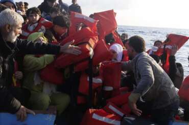 Life vests are distributed to migrants as they are being rescued by a MSF (Medecins Sans Frontiers) rescue team boat, after leaving Libya trying to reach European soil, in the Mediterranean Sea, Friday, Oct. 6, 2023. (AP Photo/Paolo Santalucia) Associated Press/LaPresse Only Italy and Spain