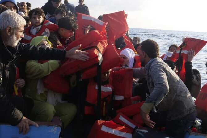 Life vests are distributed to migrants as they are being rescued by a MSF (Medecins Sans Frontiers) rescue team boat, after leaving Libya trying to reach European soil, in the Mediterranean Sea, Friday, Oct. 6, 2023. (AP Photo/Paolo Santalucia) Associated Press/LaPresse Only Italy and Spain
