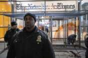 New York Police Officers stand guard in front of the New York Times building entrance after being vandalized with red tint by Pro-Palestinian demonstrators as they march calling for a cease fire in Gaza, Friday, Nov. 10, 2023, in New York. (AP Photo/Eduardo Munoz Alvarez)