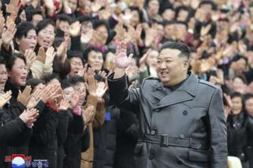 This photo provided on Dec. 9, 2023, by the North Korean government, North Korean leader Kim Jong Un waves to the participants of the National Mothers’ Meeting in Pyongyang, North Korea on Dec. 8, 2023. Independent journalists were not given access to cover the event depicted in this image distributed by the North Korean government. The content of this image is as provided and cannot be independently verified. Korean language watermark on image as provided by source reads: “KCNA” which is the abbreviation for Korean Central News Agency. (Korean Central News Agency/Korea News Service via AP)