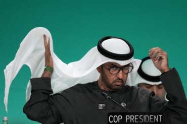 COP28 President Sultan al-Jaber adjust his ghutra during a plenary stocktaking session at the COP28 U.N. Climate Summit, Monday, Dec. 11, 2023, in Dubai, United Arab Emirates. (AP Photo/Rafiq Maqbool)
