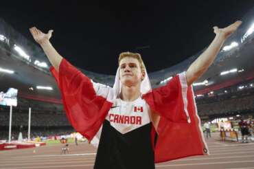 FILE – Canada’s Shawn Barber celebrates after winning the gold medal in the men’s pole vault final at the World Athletics Championships at the Bird’s Nest stadium in Beijing, Monday, Aug. 24, 2015. Barber has died from medical complications. He was 29. Barber died Wednesday, Jan. 17, 2024, at home in Kingwood, Texas, his agent, Paul Doyle, confirmed to The Associated Press.(Christian Charisius/dpa via AP, File)