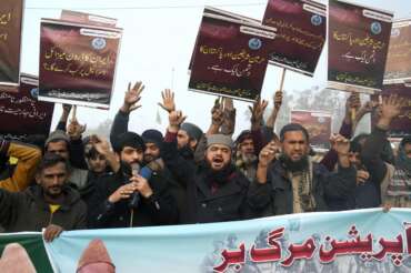 Supporters of a religious group ‘Markazi Jamiyat Ahle Hadith Pakistan’ hold a demonstration to condemn Iran strike in the Pakistani border area, in Lahore, Pakistan, Friday, Jan. 19, 2024. The unprecedented attacks by both Pakistan and Iran on either side of their border appeared to target Baluch militant groups with similar separatist goals. The countries accuse each other of providing a haven to the groups in their respective territories. (AP Photo/K.M. Chaudary)
