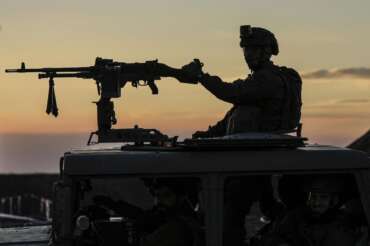 An Israeli soldier takes up position on the border with the Gaza Strip in southern Israel, Monday, Jan. 29, 2024. (AP Photo/Tsafrir Abayov)