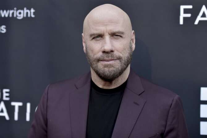 FILE – In this Aug. 22, 2019 file photo, actor John Travolta attends the LA premiere of “The Fanatic” at the Egyptian Theatre in Los Angeles. The Maine mansion that Travolta shared with his late wife, actor Kelly Preston, has been put up for sale. The 67-year-old star of “Grease” and “Saturday Night Fever” recently listed the home on Islesboro, an island off the coast of Maine, for $5 million, according to the Portland Press Herald. (Photo by Richard Shotwell/Invision/AP, File)