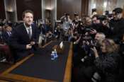 Meta CEO Mark Zuckerberg, takes his seat as he arrives to testify at a Senate Judiciary Committee hearing about the online child sexual exploitation, on Capitol Hill, Wednesday, Jan. 31, 2024, in Washington. (AP Photo/Manuel Balce Ceneta)