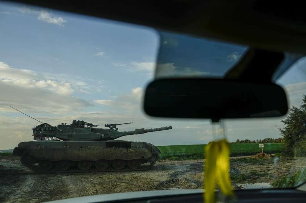 Israeli soldiers drive a tank on the border with the Gaza Strip, as seen from southern Israel, Sunday, Feb. 4, 2024. The army is battling Palestinian militants across Gaza in the war ignited by Hamas’ Oct. 7 attack into Israel. (AP Photo/Ariel Schalit)
