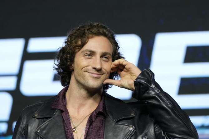 Actor Aaron Taylor-Johnson gestures as he poses for the media before the news conference to promote his latest movie “Bullet Train” in Seoul, South Korea, Friday, Aug. 19, 2022. The movie is to be released in the country on Aug. 24. (AP Photo/Lee Jin-man)