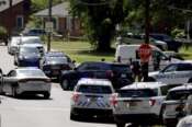 Multiple law enforcement vehicles respond in the neighborhood where several officers on a task force trying to serve a warrant were shot in Charlotte, N.C., Monday, April 29, 2024. (Khadejeh Nikouyeh/The Charlotte Observer via AP)