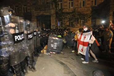 Riot police block opposition protesters gathered to protest against “the Russian law” in Tbilisi, Georgia, Tuesday, April 30, 2024. Clashes erupted between police and opposition demonstrators protesting a new bill intended to track foreign influence that the opposition denounced as Russia-inspired. (AP Photo/Zurab Tsertsvadze)