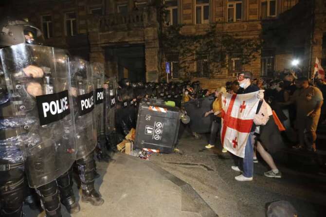 Riot police block opposition protesters gathered to protest against “the Russian law” in Tbilisi, Georgia, Tuesday, April 30, 2024. Clashes erupted between police and opposition demonstrators protesting a new bill intended to track foreign influence that the opposition denounced as Russia-inspired. (AP Photo/Zurab Tsertsvadze)