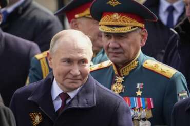 FILE – Russian President Vladimir Putin, left, and Russian Defense Minister Sergei Shoigu leave Red Square after the Victory Day military parade in Moscow, Russia, Thursday, May 9, 2024, marking the 79th anniversary of the end of World War II. Russian President Vladimir Putin has proposed removing Defense Minister Sergei Shoigu from his post. Putin nominated First Deputy Prime Minister Andrey Belousov for the role. (AP Photo/Alexander Zemlianichenko, File)