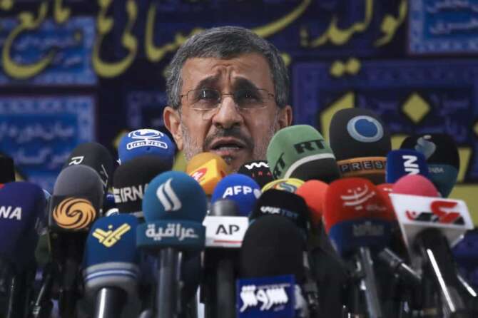 Former President Mahmoud Ahmadinejad speaks with the media after registering his name as a candidate for the June 18 presidential elections at elections headquarters of the Interior Ministry in Tehran, Iran, Wednesday, May 12, 2021. The country’s former firebrand president will run again for office in upcoming elections in June. The Holocaust-denying Ahmadinejad has previously been banned from running for the presidency by Supreme Leader Ayatollah Ali Khamenei in 2017, although then, he registered anyway. (AP Photo/Vahid Salemi)