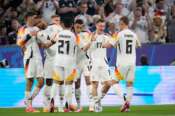 Germany’s Florian Wirtz, second right, celebrates after scoring his side’s opening goal during a Group A match between Germany and Scotland at the Euro 2024 soccer tournament in Munich, Germany, Friday, June 14, 2024. (AP Photo/Matthias Schrader) Associated Press / LaPresse Only italy and Spain