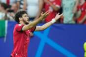 Georgia’s Khvicha Kvaratskhelia celebrates after scoring his side’s first goal during a Group F match between Georgia and Portugal at the Euro 2024 soccer tournament in Gelsenkirchen, Germany, Wednesday, June 26, 2024. (AP Photo/Alessandra Tarantino)