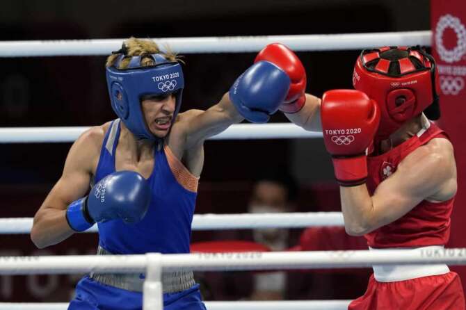 Ireland’s Kellie Anne Harrington, right, exchanges punches with Algeria’s Imane Khelif during their women’s lightweight 60-kg quarterfinal boxing match at the 2020 Summer Olympics, Tuesday, Aug. 3, 2021, in Tokyo, Japan. (AP Photo/Themba Hadebe)