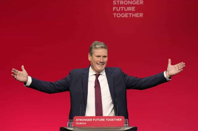 FILE – Leader of the British Labour Party Keir Starmer gestures as he arrives to make his keynote speech at the annual party conference in Brighton, England, on Sept. 29, 2021. The Labour Party hopes that is just what Britain wants and needs after 14 turbulent years of Conservative rule. Starmer, the center-left party’s 61-year-old leader, is the current favorite to win the country’s July 4 election. (AP Photo/Alastair Grant, File)