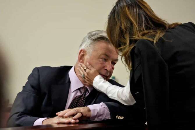 Actor Alec Baldwin talks with his wife Hilaria during his involuntary manslaughter trial over a fatal shooting on the set of the film, “Rust,” in Santa Fe, N.M., July 10, 2024. (AP Photo/Ross D. Franklin, Pool)