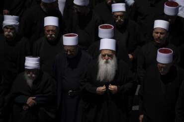 Druze clergymen attend the funeral of some of the 12 children and teens killed in a rocket strike at a soccer field at the village of Majdal Shams,in the Israeli-annexed Golan Heights, Sunday, July 28, 2024. It’s the deadliest strike on an Israeli target along the country’s northern border since the fighting between Israel and the Lebanese militant group Hezbollah began. (AP Photo/Leo Correa) Associated Press / LaPresse Only italy and Spain