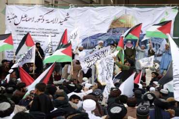 Afghan people attend a demonstration to condemn the killing of Hamas leader Ismail Haniyeh, who was killed in Tehran, and to show solidarity with Palestinian people living in Gaza, in Herat province, western Afghanistan, Wednesday, Aug. 7, 2024. (AP Photo/Omid Haqjoo)