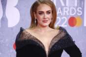 FILE – Adele appears at the Brit Awards in London on Feb. 8, 2022. Adele paid homage to the many women – including her mother, grandmother and aunts – who helped shape her world and personality as she accepted the Sherry Lansing leadership award at The Hollywood Reporter’s Women in Entertainment breakfast gala Thursday, Dec. 7, 2023. (Photo by Joel C Ryan/Invision/AP, File)