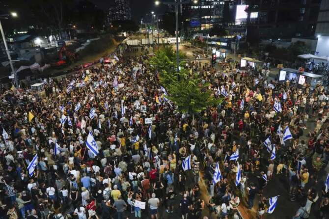 People attend a rally demanding a cease-fire deal and the immediate release of hostages held by Hamas on Wednesday, Sept. 4, 2024, in Tel Aviv, Israel. (AP Photo/Ariel Schalit)
