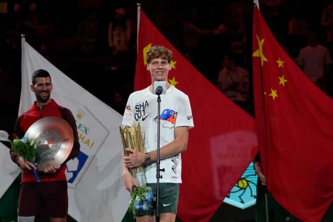 Jannik Sinner of Italy speaks with his trophy after defeating Novak Djokovic of Serbia in the men’s singles finals match for the Shanghai Masters tennis tournament at Qizhong Forest Sports City Tennis Center in Shanghai, China, Sunday, Oct. 13, 2024. (AP Photo/Andy Wong)