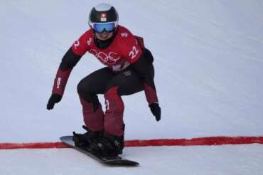 Switzerland’s Sophie Hediger competes during the women’s snowboard cross qualification round at the 2022 Winter Olympics, Wednesday, Feb. 9, 2022, in Zhangjiakou, China. (AP Photo/Aaron Favila)