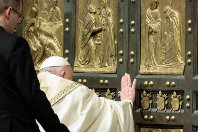 Pope Francis opens the Holy Door to mark the opening of the 2025 Catholic Holy Year, or Jubilee, in St. Peter’s Basilica, at the Vatican, Dec. 24, 2024. (Remo Casilli/Pool Photo via AP)
