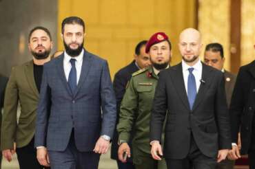 Syria’s de facto leader Ahmad al-Sharaa, oreground left, formerly known as Abu Mohammed al-Golani, meets with Walid Ellafi, right, Libyan minister of state for communication and political affairs, in the presidential palace in Damascus, Syria, Saturday, Dec. 28, 2024. (AP Photo/Mosa’ab Elshamy) Associated Press / LaPresse Only italy and Spain
