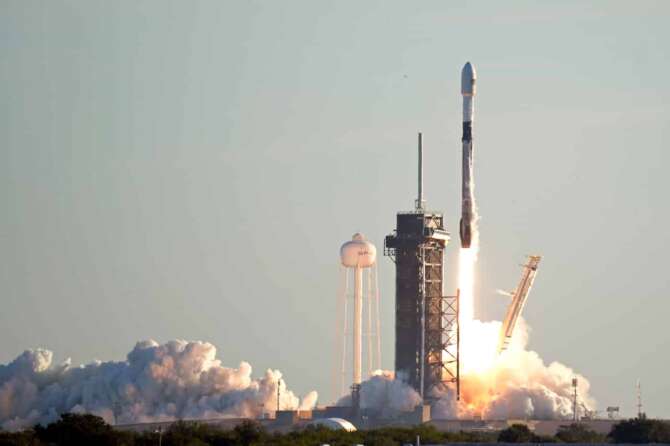 A Falcon 9 SpaceX rocket lifts off from pad 39A at the Kennedy Space Center in Cape Canaveral, Fla., Wednesday, Jan. 20, 2021. The payload is the 17th batch of approximately 60 satellites for SpaceX’s Starlink broadband network. (AP Photo/John Raoux)