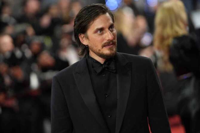 Luca Marinelli poses for photographers upon arrival at the premiere of the film ‘The Eight Mountains’ at the 75th international film festival, Cannes, southern France, Wednesday, May 18, 2022. (AP Photo/Daniel Cole)