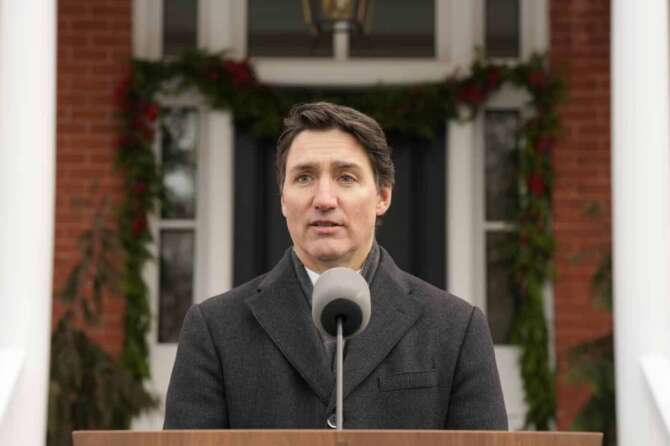 Canada Prime Minister Justin Trudeau makes an announcement outside Rideau Cottage in Ottawa on Monday, Jan. 6, 2025. (Adrian Wyld/The Canadian Press via AP)