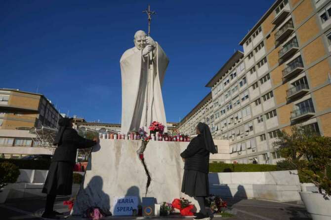 Nuns pray for Pope Francis in front of the Agostino Gemelli Polyclinic, in Rome, Saturday, Feb. 22, 2025, where the Pontiff is hospitalized since Friday, Feb. 14.(AP Photo/Alessandra Tarantino)
