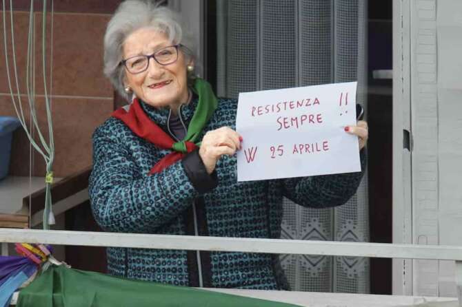 Former partisan Teresa Vergalli, 93, nicknamed Annuska, holds a note reading in Italian “Resistance always, long live Aprile 25”, as she poses at her window in Rome, Thursday, April 23, 2020. On April 25 every year Italy celebrates the end of the Nazi occupation during WWII. The date is also the occasion for the members of the National Association of Italian Partisans to celebrate their uprising against the fascist rule of dictator Benito Mussolini, backed up by the Nazis, with marches throughout the country. The COVID-19 outbreak in Italy this year forced the cancellation of all the activities to celebrate the 75th anniversary of the Italian Liberation Day. (AP Photo/Andrew Medichini)