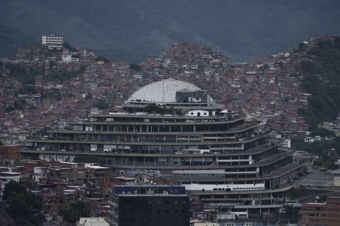 Venezuela’s police intelligence headquarters known as El Helicoide stands in front of La Cota 905 neighborhood in Caracas, Venezuela, Monday, Sept. 12, 2022. (AP Photo/Ariana Cubillos)