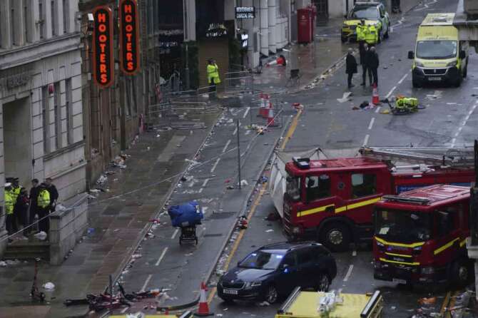 Fans leave as Police and emergency personnel deal with an incident after a car collided with pedestrians near the Liver Building during the Premier League winners parade in Liverpool, England, Monday, May 26, 2025.(AP Photo/Jon Super) Associated Press / LaPresse Only italy and spain