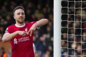 Liverpool’s Diogo Jota celebrates after scoring his side’s third goal during the English Premier League soccer match between Fulham and Liverpool at Craven Cottage stadium in London, Sunday, April 21, 2024. (AP Photo/Kirsty Wigglesworth)