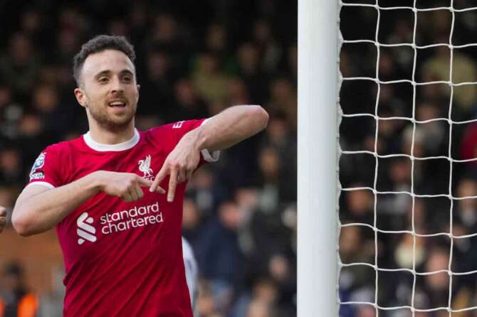 Liverpool’s Diogo Jota celebrates after scoring his side’s third goal during the English Premier League soccer match between Fulham and Liverpool at Craven Cottage stadium in London, Sunday, April 21, 2024. (AP Photo/Kirsty Wigglesworth)