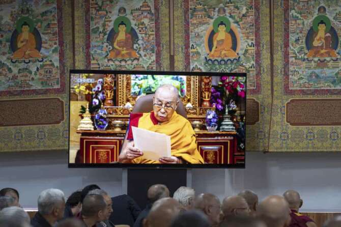 Buddhist monks of various schools of Tibetan Buddhism watch a recorded video message by Tibetan spiritual leader the Dalai Lama in Dharamshala, India, Wednesday, July 2, 2025, ahead of his birthday according to the Gregorian calendar on July 6. (AP Photo/Ashwini Bhatia)