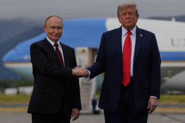 President Donald Trump greets Russia’s President Vladimir Putin Friday, Aug. 15, 2025, at Joint Base Elmendorf-Richardson, Alaska. (AP Photo/Julia Demaree Nikhinson)