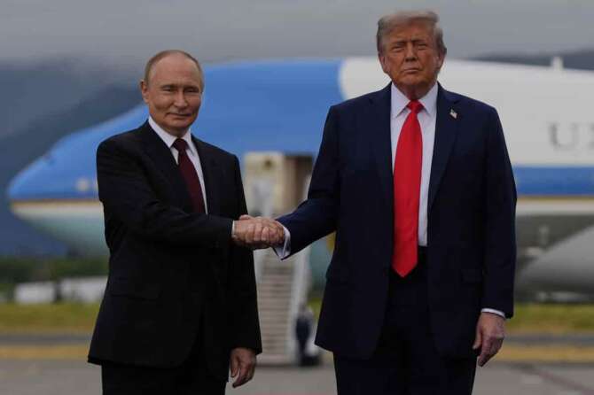 President Donald Trump greets Russia’s President Vladimir Putin Friday, Aug. 15, 2025, at Joint Base Elmendorf-Richardson, Alaska. (AP Photo/Julia Demaree Nikhinson)