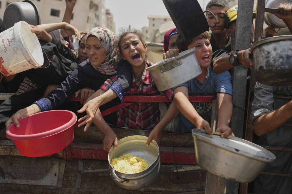 FILE – Palestinians struggle to get donated food at a community kitchen in Gaza City. AP Photo/Jehad Alshrafi, File) 


Associated Press / LaPresse