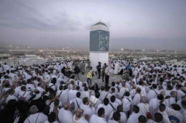 Muslim pilgrims gather at top of the rocky hill known as the Mountain of Mercy, on the Plain of Arafat, during the annual Hajj pilgrimage, near the holy city of Mecca, Saudi Arabia, Tuesday, June 27, 2023. Around two million pilgrims are converging on Saudi Arabia’s holy city of Mecca for the largest Hajj since the coronavirus pandemic severely curtailed access to one of Islam’s five pillars. (AP Photo/Amr Nabil)