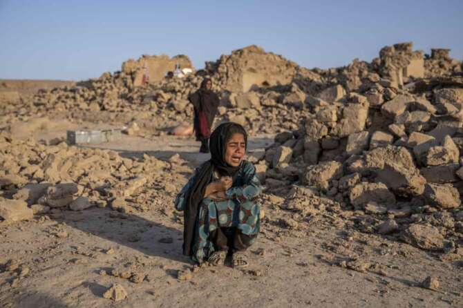 An Afghan girl cries in front of her house that was destroyed by the earthquake in Zenda Jan district in Herat province, western Afghanistan, Wednesday, Oct. 11, 2023. Another strong earthquake shook western Afghanistan on Wednesday morning after an earlier one killed more than 2,000 people and flattened whole villages in Herat province in what was one of the most destructive quakes in the country’s recent history. (AP Photo/Ebrahim Noroozi) Associated Press/LaPresse Only Italy and Spain