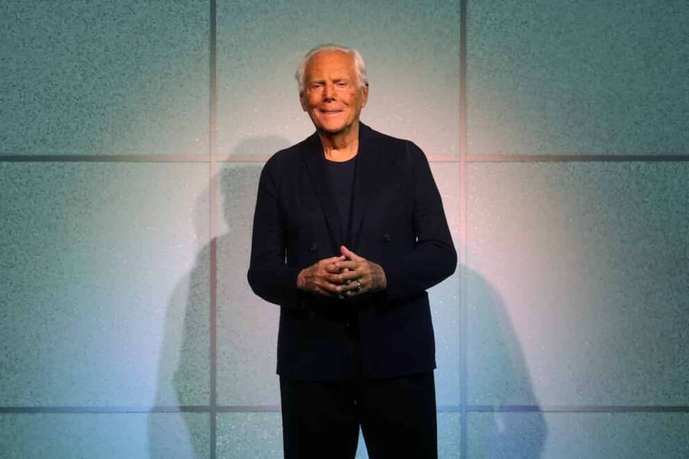 Designer Giorgio Armani accepts applause after the conclusion of his women’s Fall-Winter 2024-25 collection presented in Milan, Italy, Sunday, Feb. 25, 2024. (AP Photo/Luca Bruno) Associated Press/LaPresse Only Italy and Spain