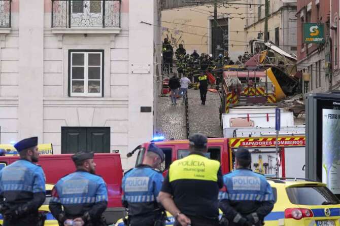Emergency teams work at the site of a derailed electric streetcar in Lisbon, Portugal, Wednesday, Sept. 3, 2025. (AP Photo/Armando Franca)